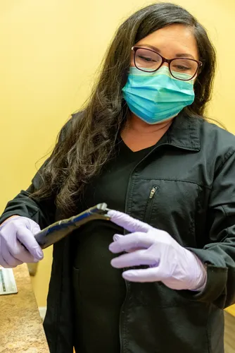 Team member with CariVu cavity detection device at Anderson Family Dentistry