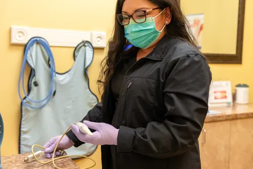 Team member with Sopro intraoral camera at Anderson Family Dentistry